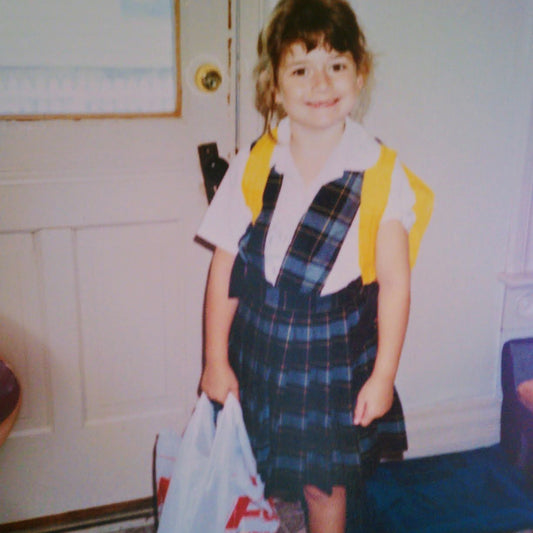The artist at age 6, on her first day of school.
