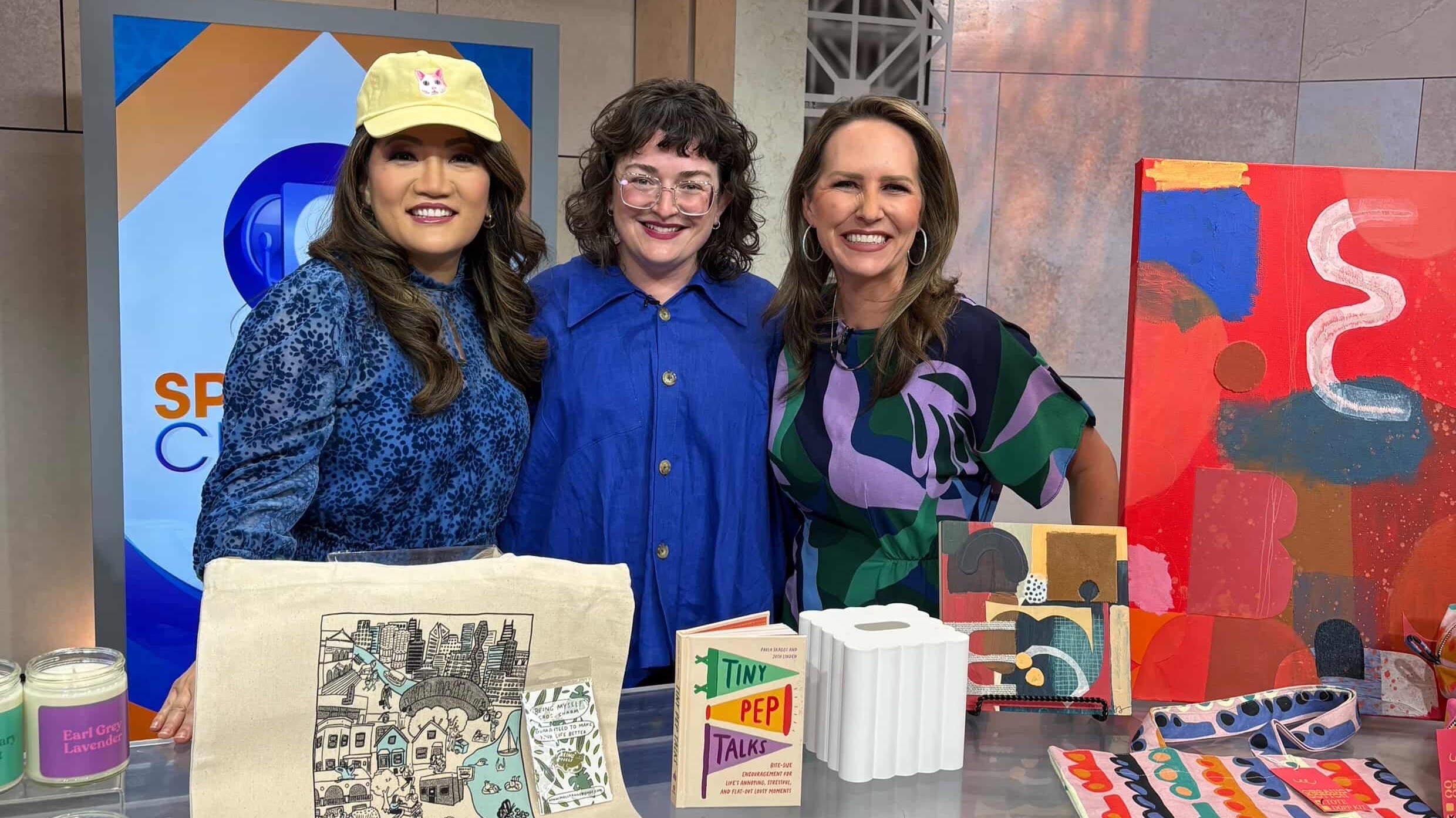 Load video: Adrianne visits WGN to talk with Sarah and Ji about products she carries that are made by women owned brands.